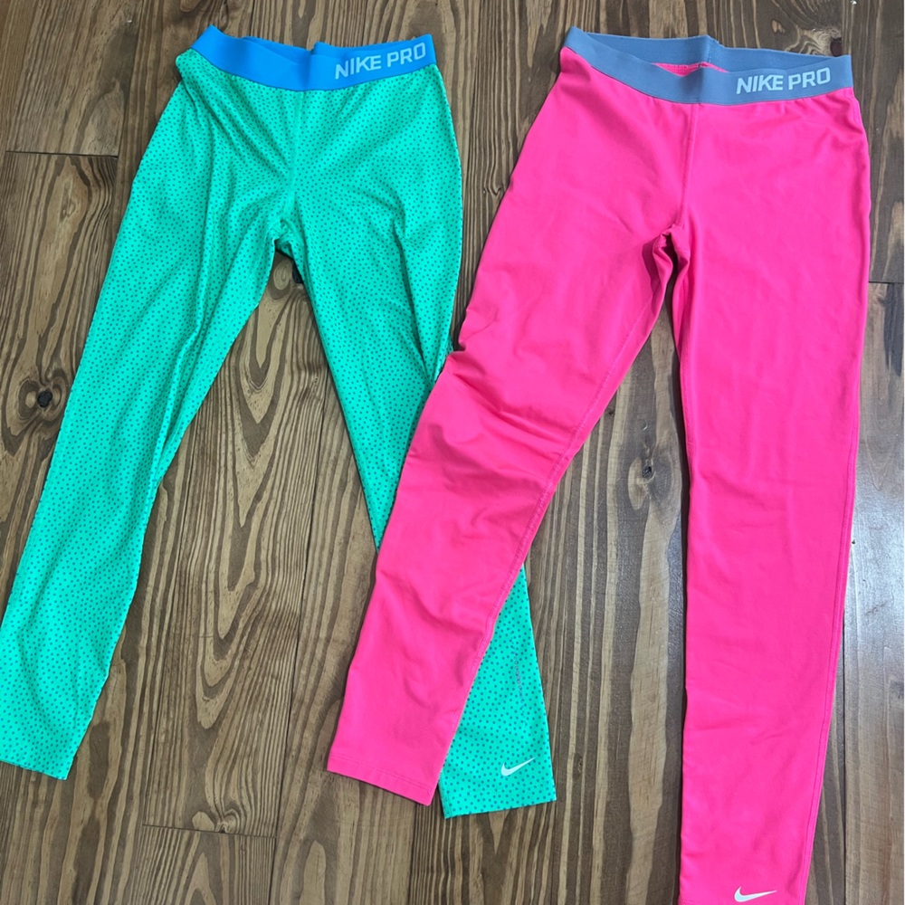 Youth Nike Pro leggings. Green youth large, pink youth XL. Fit very similar!!